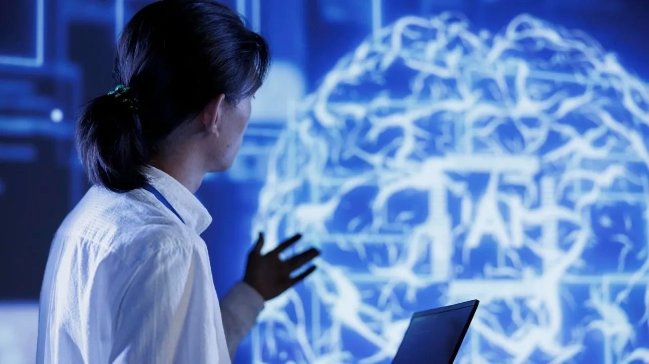 Which scientific jobs are already under pressure from AI, according to Nature